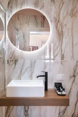 a hotel room with a bed and a television at 59 Steps Trevi in Rome