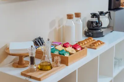 a white counter with two wooden boxes of food at Hotel Windrose in Rome