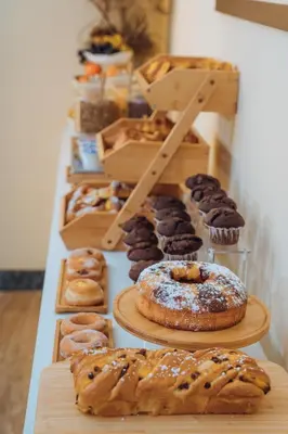 a display of different types of donuts and pastries at Hotel Windrose in Rome
