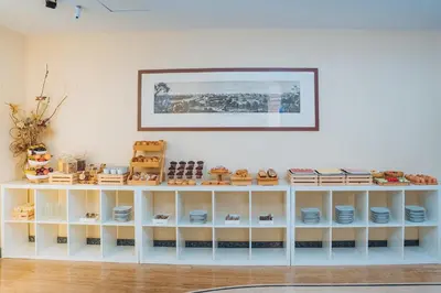 a shelf filled with plates and dishes on a wall at Hotel Windrose in Rome
