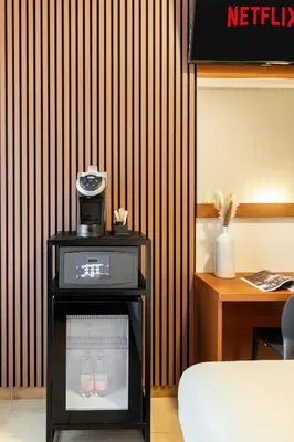 a room with a coffee maker on a table at AlbaDomus Affittacamere o GuestHouse in Rome
