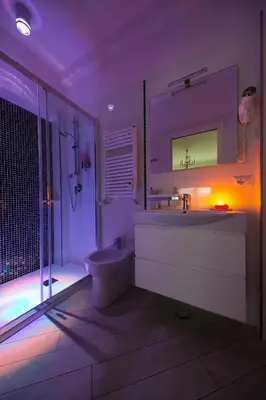 a bathroom with a sink and a toilet and a shower at Suites Roma Tiburtina Elegance in Rome