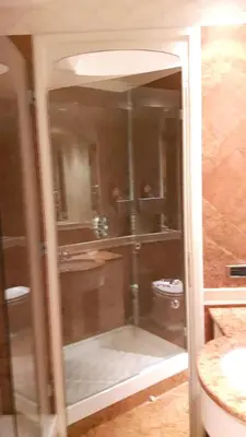 a glass shower in a bathroom with a sink at Giulio Caesar in Rome