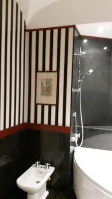 a bathroom with a toilet and a sink and a shower at Giulio Caesar in Rome