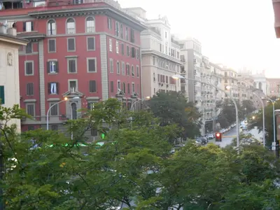 a city street with tall buildings and street lights at Suite 59 romeholidayhome in Rome