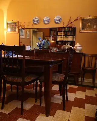 a dining room with a wooden table and chairs at Suite 59 romeholidayhome in Rome