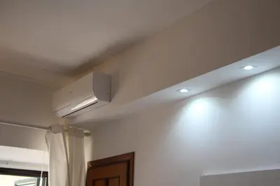 a room with a white ceiling with a air conditioner at Le Bellezze Vaticane in Rome