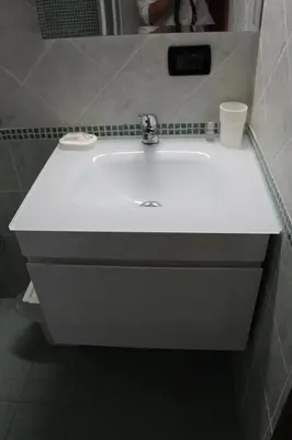 a white sink in a bathroom with a mirror at Le Bellezze Vaticane in Rome