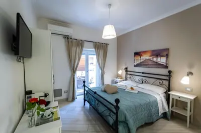 a bedroom with a bed and a television in it at B&B Saint Paul in Rome