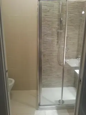 a bathroom with a shower and a toilet and a sink at B&B Saint Paul in Rome
