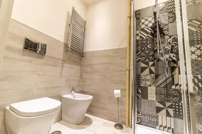 a bathroom with a toilet and a shower at B&B Saint Paul in Rome