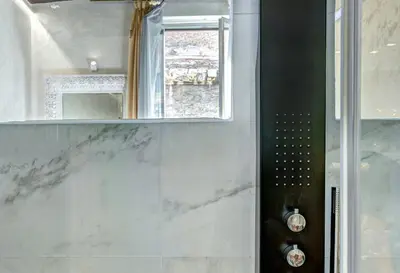 a bathroom with a shower and a mirror at Hub Pantheon in Rome