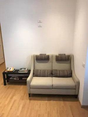 a couch in a living room with a table at Room 14 in Rome