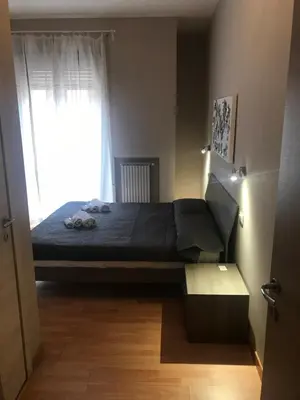 a bedroom with a bed and a window at Room 14 in Rome
