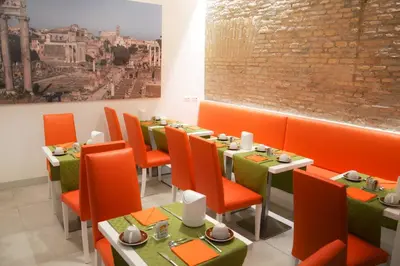 a dining room with orange chairs and tables at Navona Luxury Guesthouse in Rome