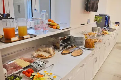 a buffet with a lot of food and drinks at Navona Luxury Guesthouse in Rome