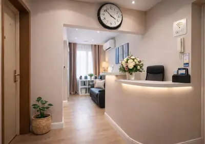 a waiting room with a clock on the wall at Tollì rooms in Rome