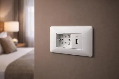 a lightswitch on a wall in a hotel room at Tollì rooms in Rome