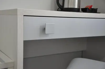 a white cabinet with a drawer and a switch at Maison Imperiale in Rome