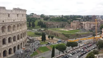 an aerial view of theatican city with the coliseum at Maison Imperiale in Rome