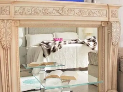 a bedroom with a bed and a mirror with books at Vatican View Apartment in Rome
