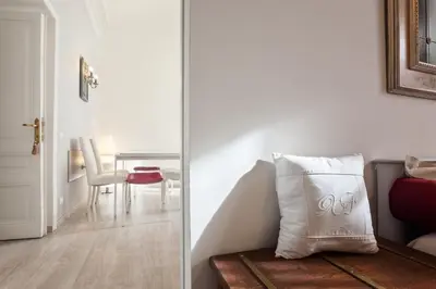 a living room with a table and a pillow at Vatican View Apartment in Rome