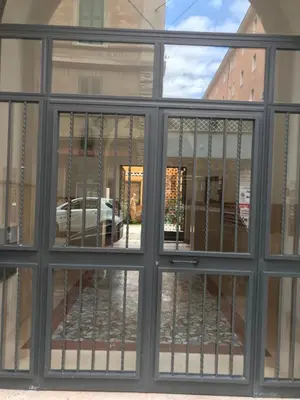 a view through a window of a building at Rome La Sapienza Apartment in Rome