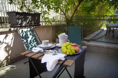 a table with a plate of fruit on it at Bausan 12 in Rome