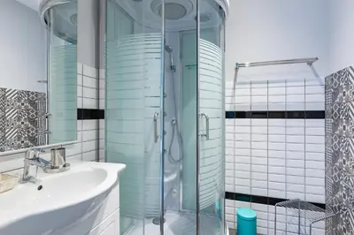 a bathroom with a glass shower and a sink at Residenza Vatican Suite in Rome