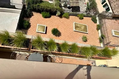 an overhead view of a building with plants on it at Hotel Principe Di Piemonte in Rome