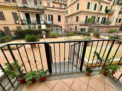 a balcony with a bunch of potted plants and buildings at Hotel Principe Di Piemonte in Rome