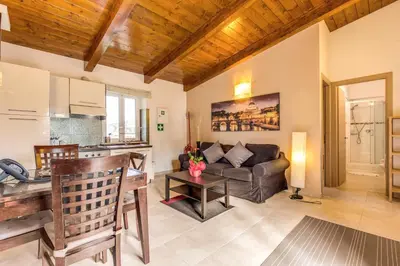 a living room with a couch and a table at Aurelia Vatican Apartments in Rome