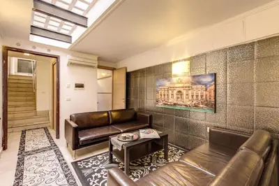 a living room with a couch and a table at Aurelia Vatican Apartments in Rome