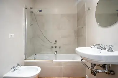 a bathroom with a sink and a tub and a toilet at Gatsby Guest House - Zen 60 in Rome