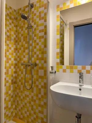 a bathroom with a sink and a shower at Green Rooms Trastevere in Rome