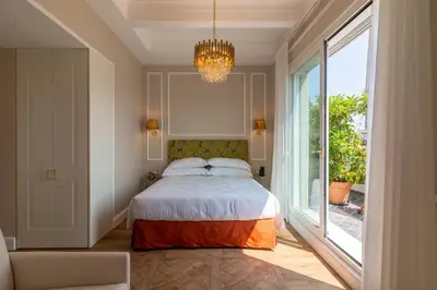 a bedroom with a white bed and a television at Best Western Hotel Rivoli in Rome
