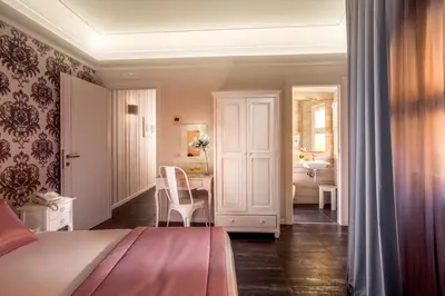 a bedroom with a bed and a bathroom at Rome Visits in Rome