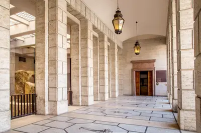 a hallway of a building with two pendant lights at Rome Visits in Rome