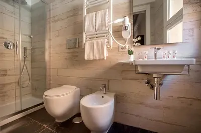 a bathroom with a toilet and a sink at Rome Visits in Rome