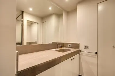 a bathroom with a sink and a mirror at Trinità dei Monti Suite in Rome