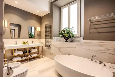 a bathroom with a tub and a sink at Eitch Borromini Palazzo Pamphilj in Rome