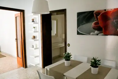 a dining room with a table and a mirror at Nonna grazia in Rome