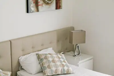 a bedroom with a bed with a pillow and a lamp at Nonna grazia in Rome