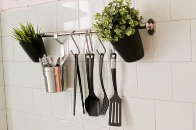 a bunch of utensils hanging on a wall at Nonna grazia in Rome