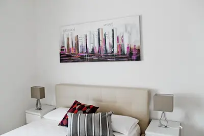 a bedroom with a bed and a picture on the wall at Nonna grazia in Rome