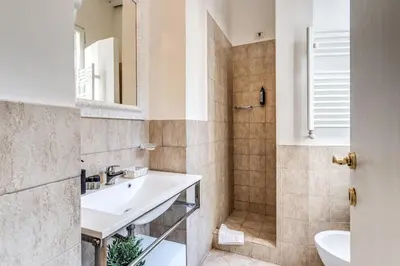 a bathroom with a sink and a shower at Magenta Deluxe Cancello in Rome