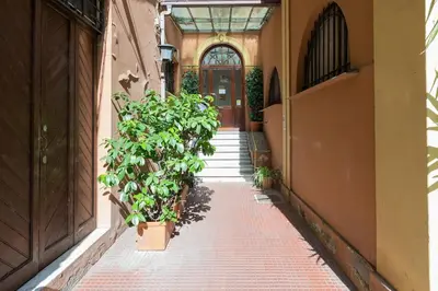 an empty hallway with potted plants in a building at Living Rome Repubblica apartment in Rome