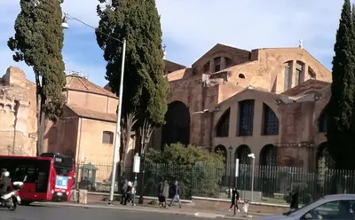 a group of people walking on a street in front of a building at Living Rome Repubblica apartment in Rome