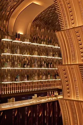 a large room filled with bottles of whiskey at Nobu Hotel Roma in Rome