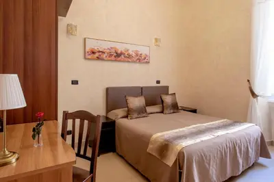a bathroom with a sink and a toilet and a shower at New Joyful Guest House in Rome